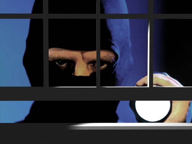 burglar with light and open window