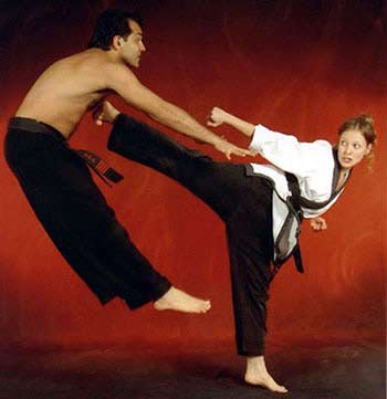 Woman straight kicking man